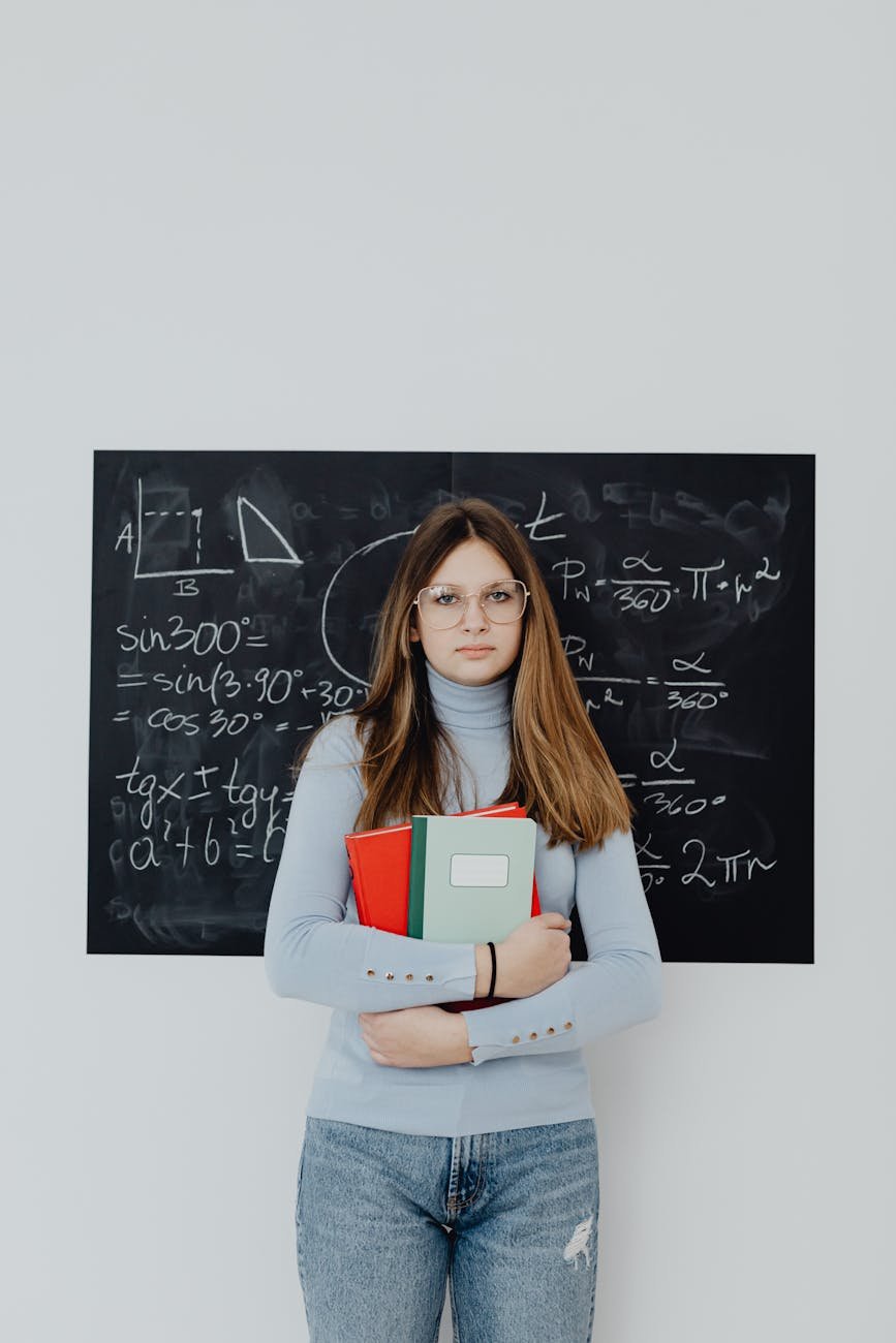 woman in front of blackboard with trigonometry calculations