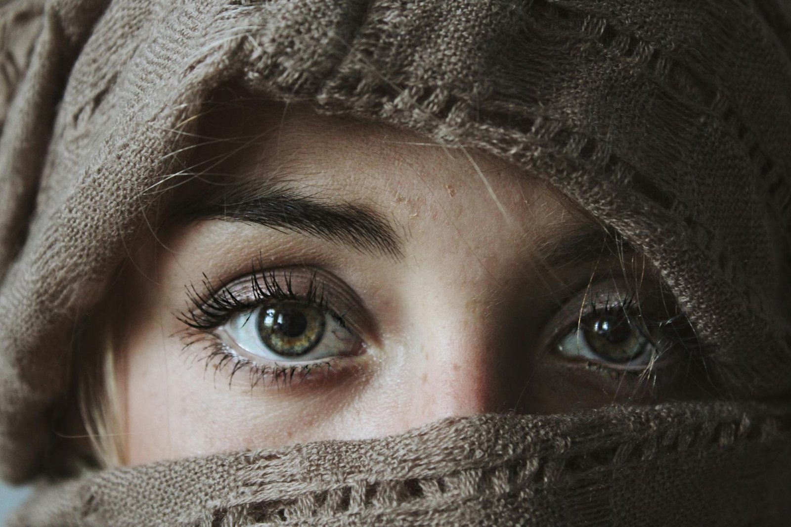 photo of person covered with brown textile