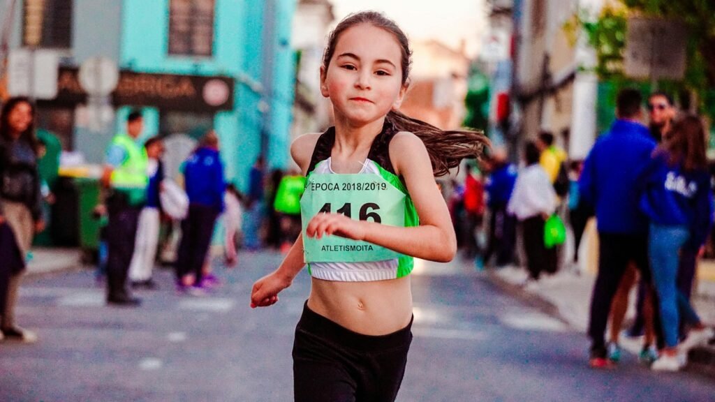photo of girl running on street