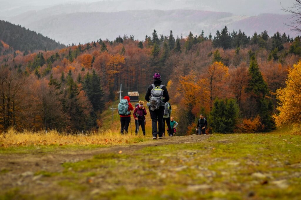 group hiking in colorful autumn forest