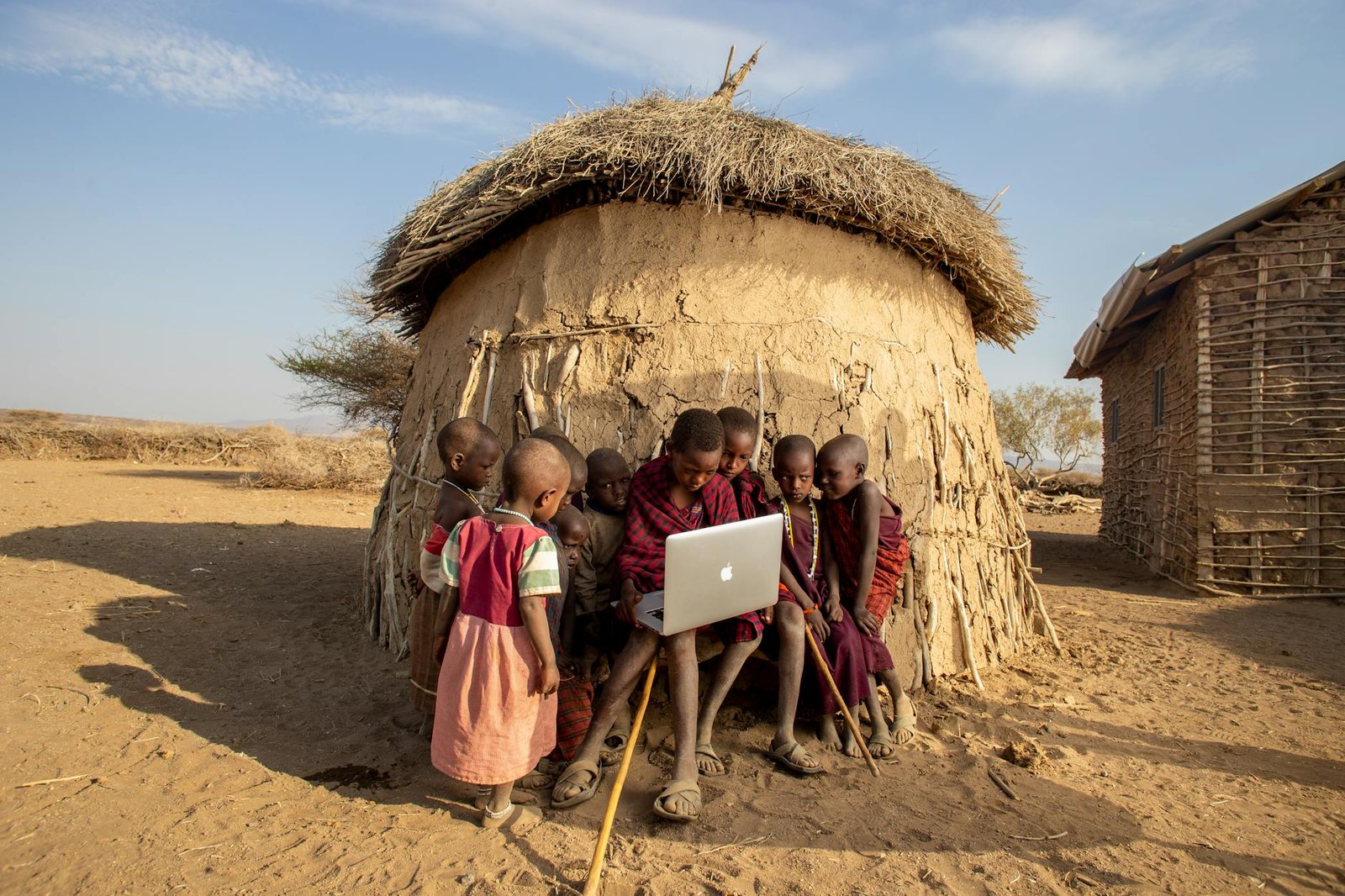 kids sitting near the laptop