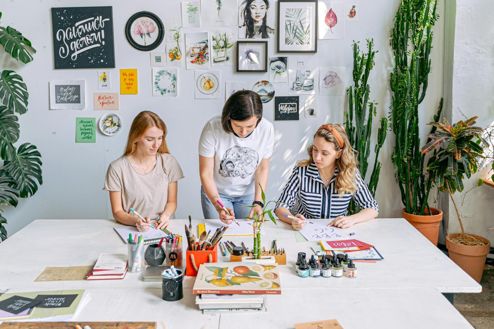 a woman teaching her students at an art school