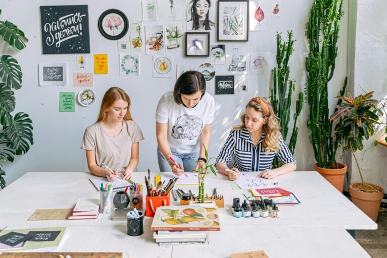 a woman teaching her students at an art school