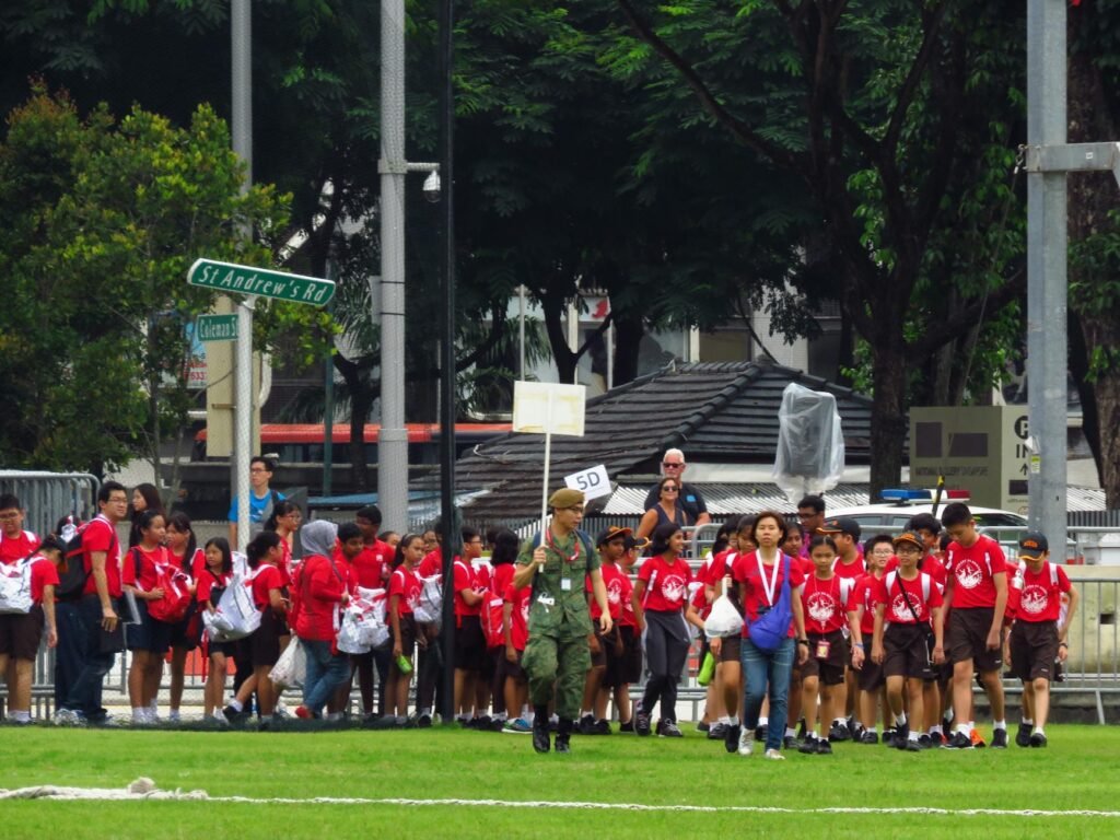 people gathered on grass field