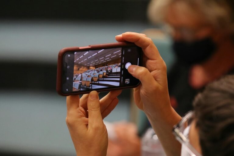a person taking a photo of an auditorium