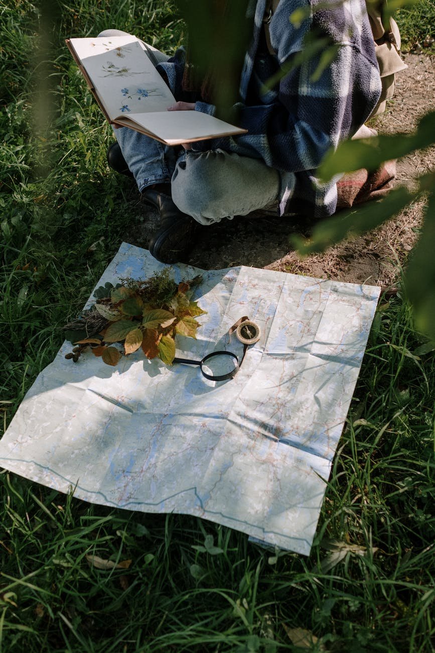 person in blue jacket and blue denim jeans standing on white textile
