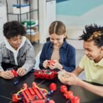 young children doing robotics together