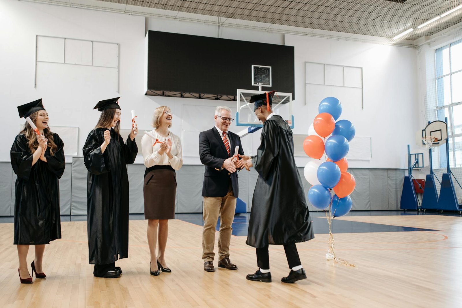 photo of man receives his diploma
