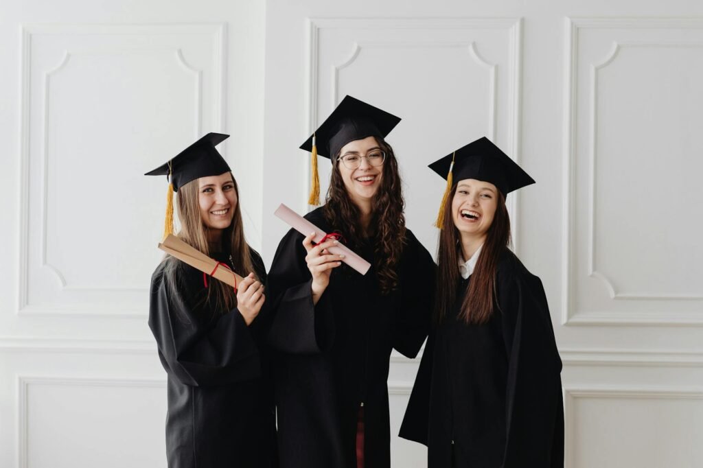 happy women in academic dress