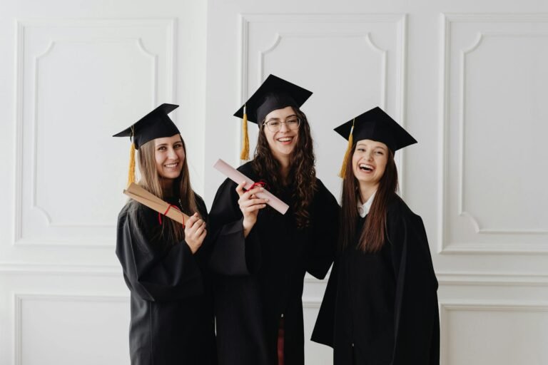 happy women in academic dress