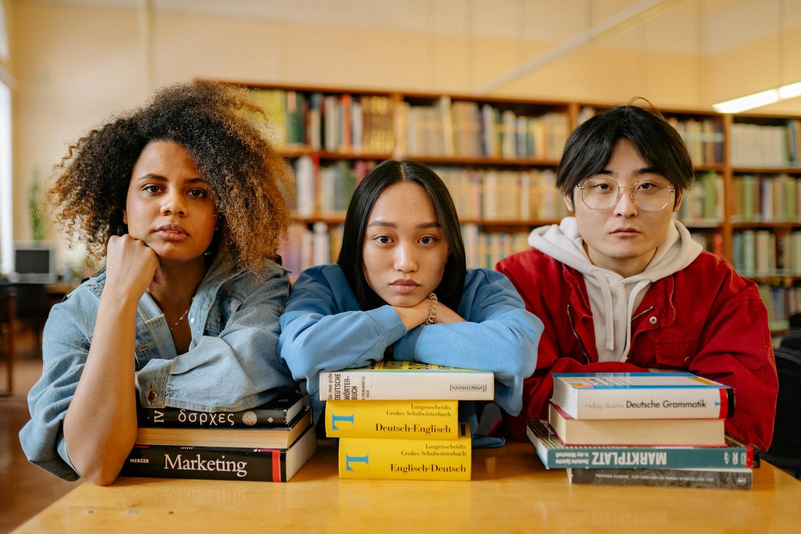 three people in the library