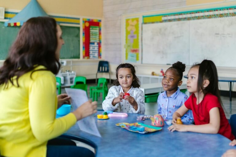 girls learning with their teacher