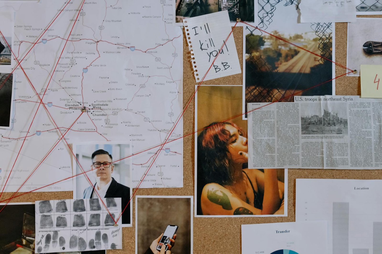 man and photos on brown corkboard