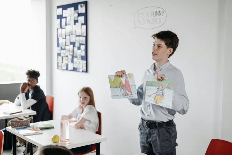 student showing his drawings