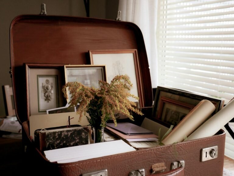 vintage suitcase with photo frames and papers