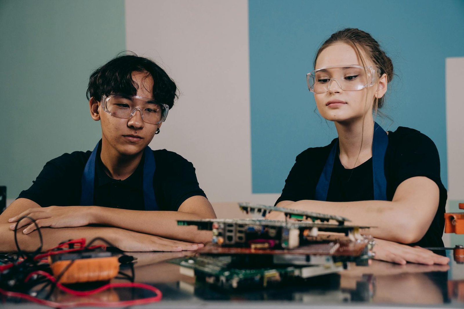 woman and man sitting by table with hardware