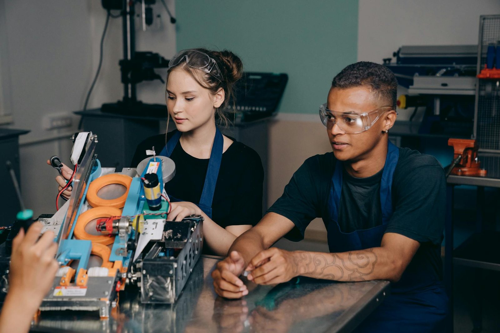 man and woman inside a factory