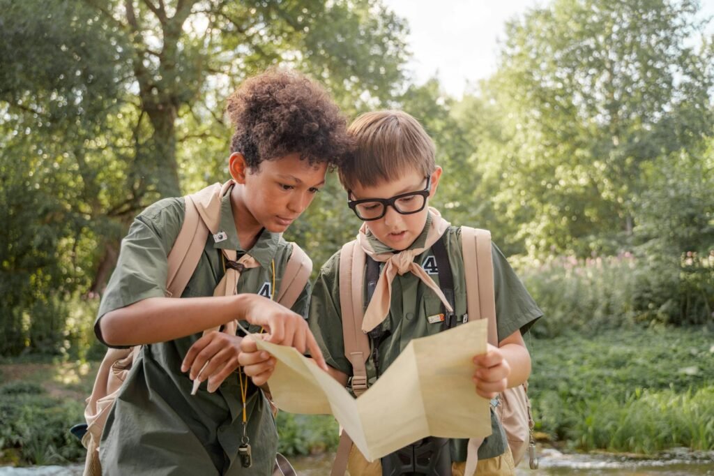 boy scouts looking at a map together