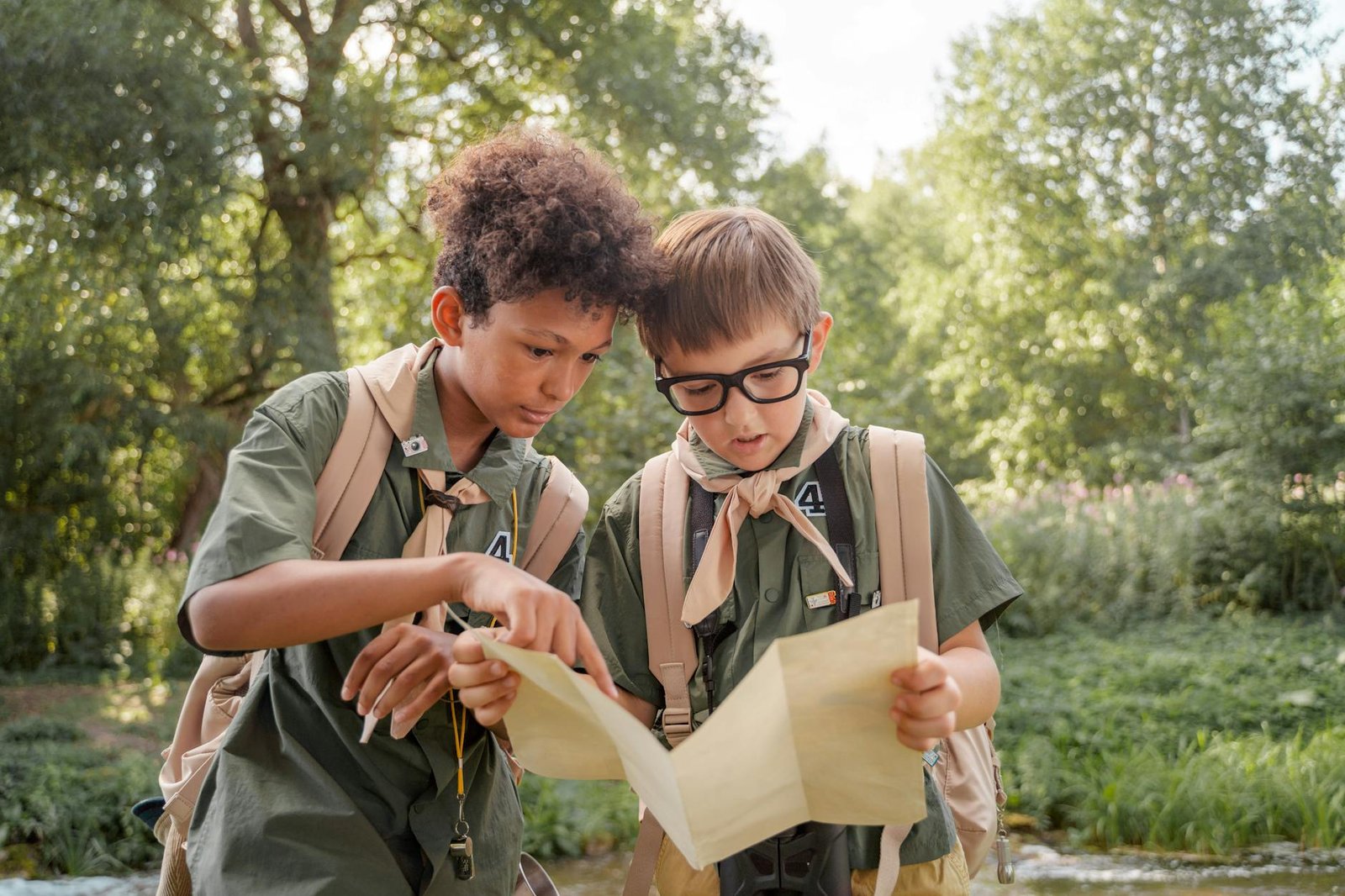 boy scouts looking at a map together
