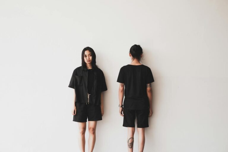 women in black clothing standing