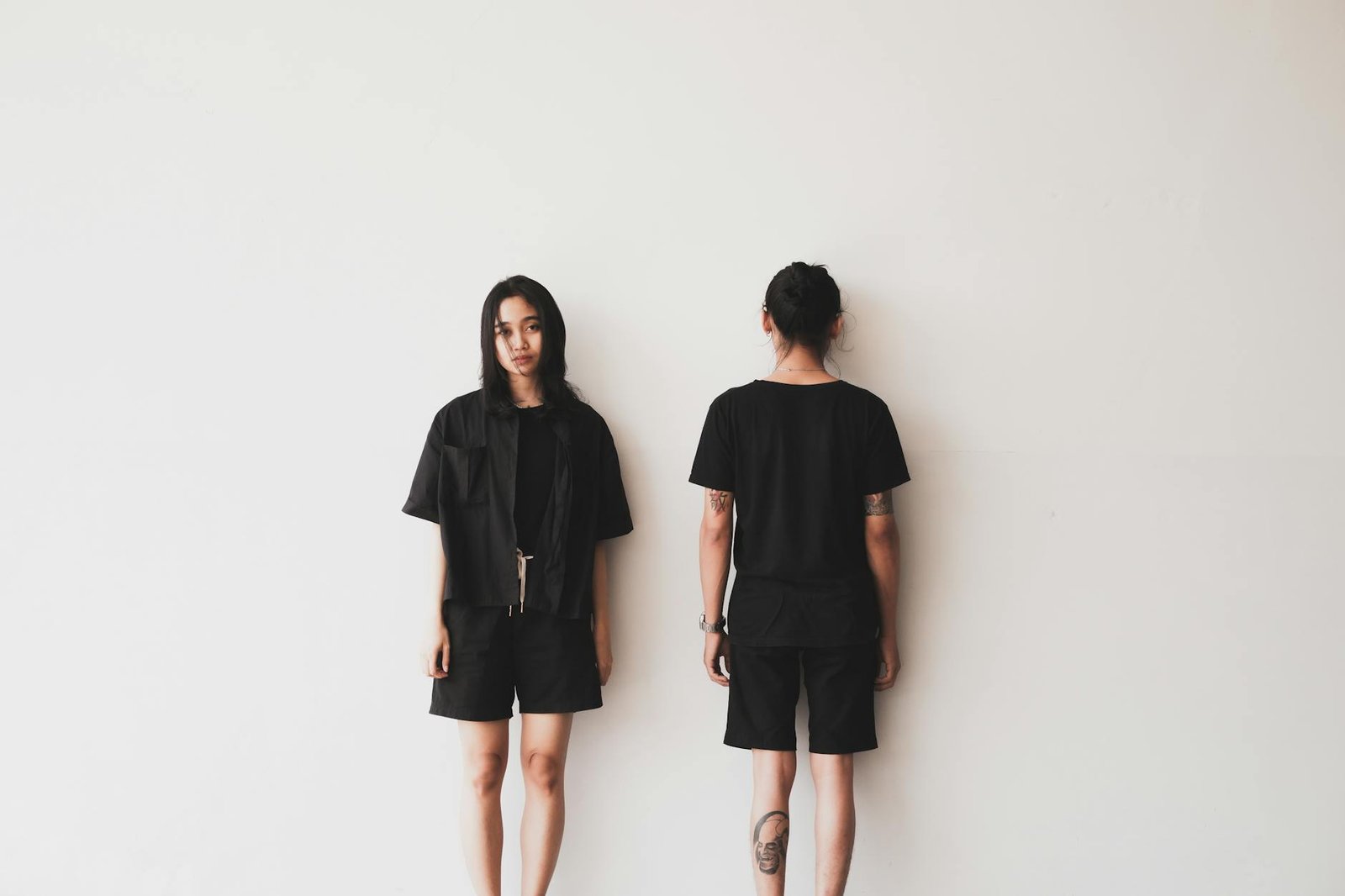 women in black clothing standing